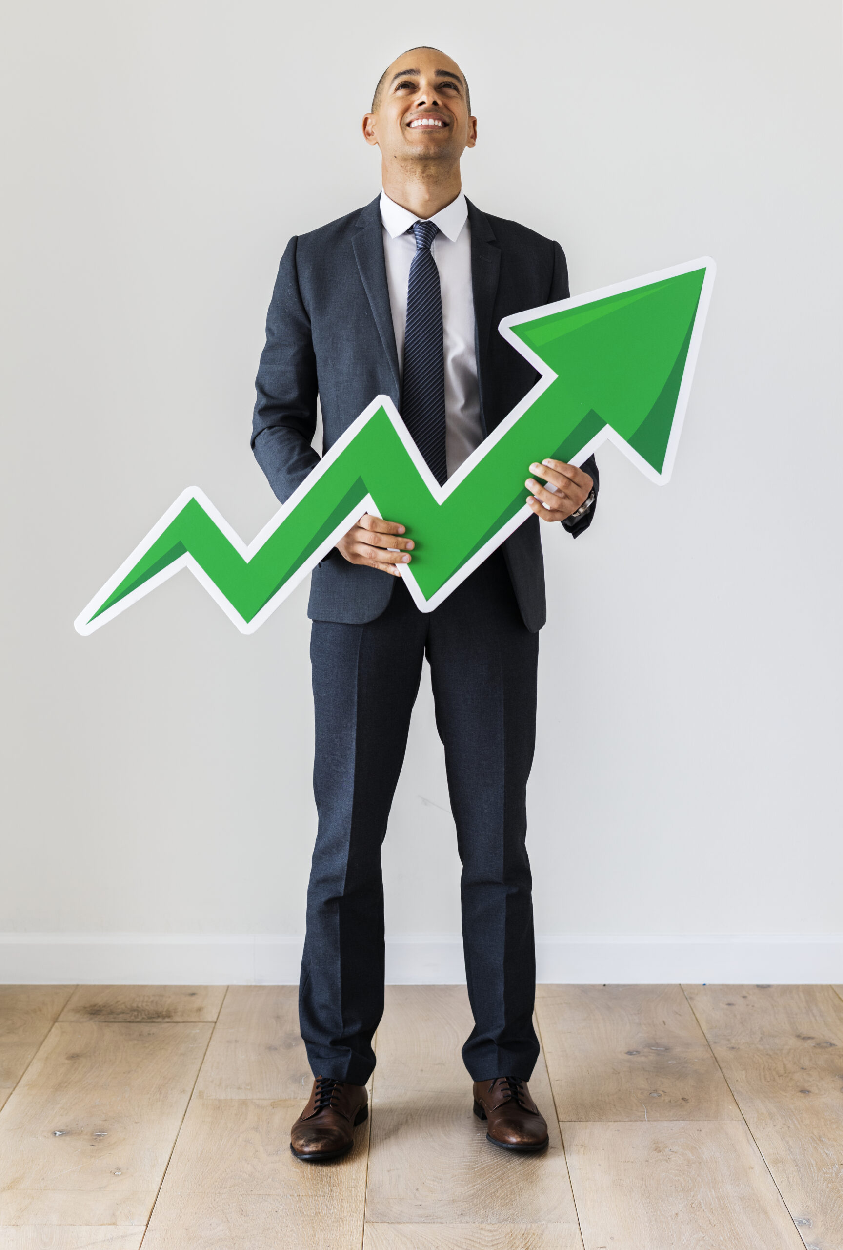 Businessman standing with icons